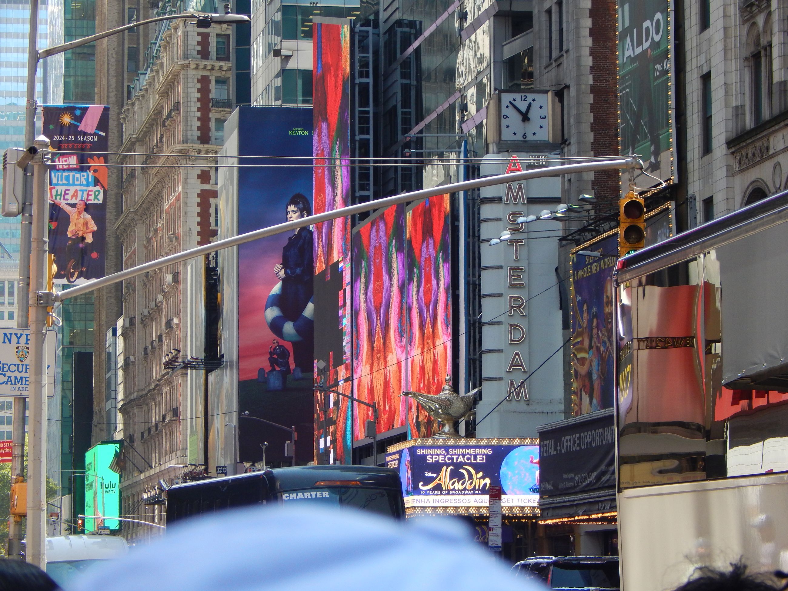 Theater signs and billboards crowding Times Square in the Broadway theater district