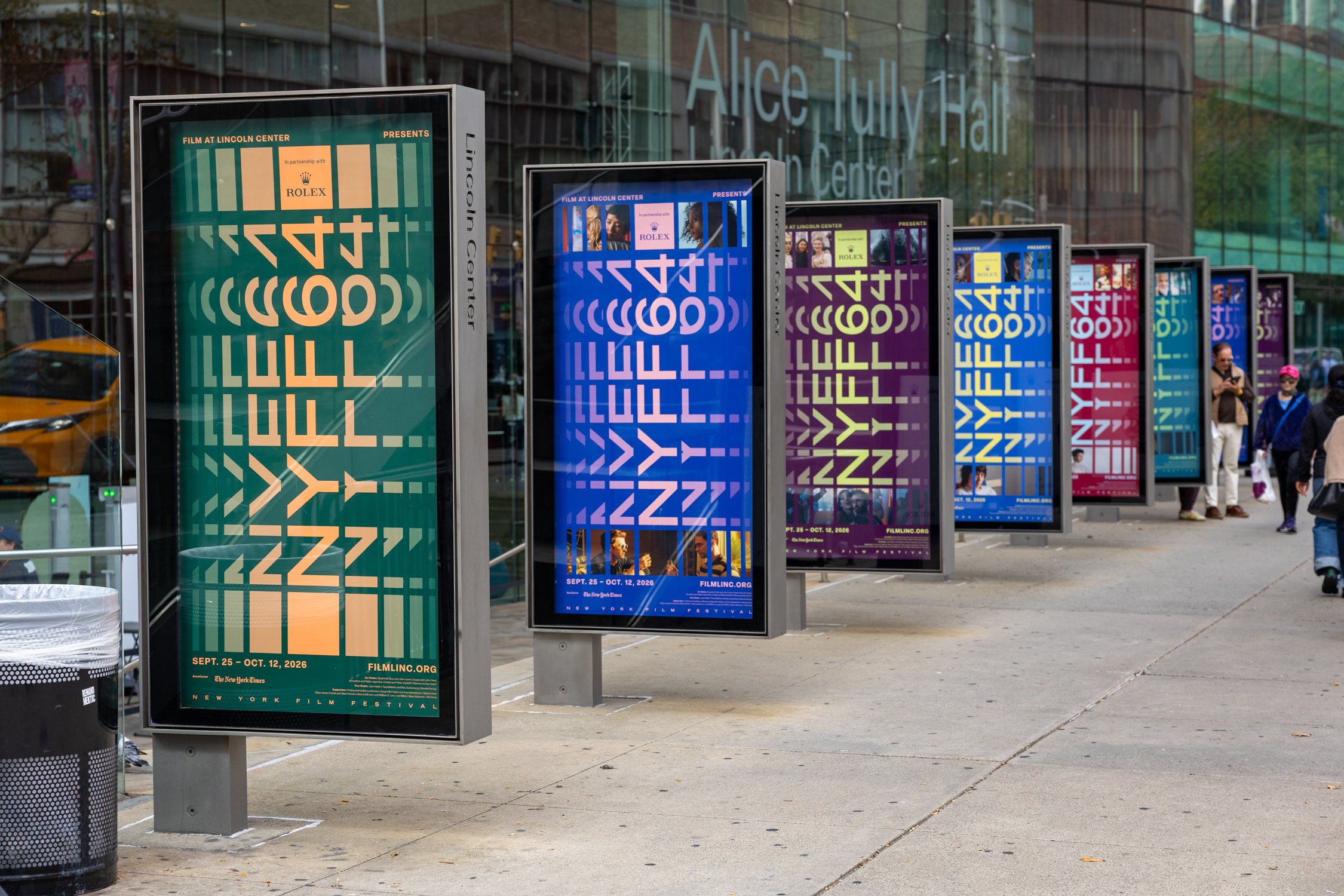 NYFF64 festival banners lining the sidewalk outside Alice Tully Hall at Lincoln Center