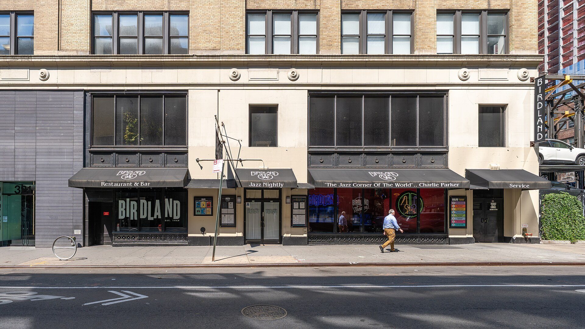 The Birdland marquee and storefronts on West 44th Street in daylight, 2026