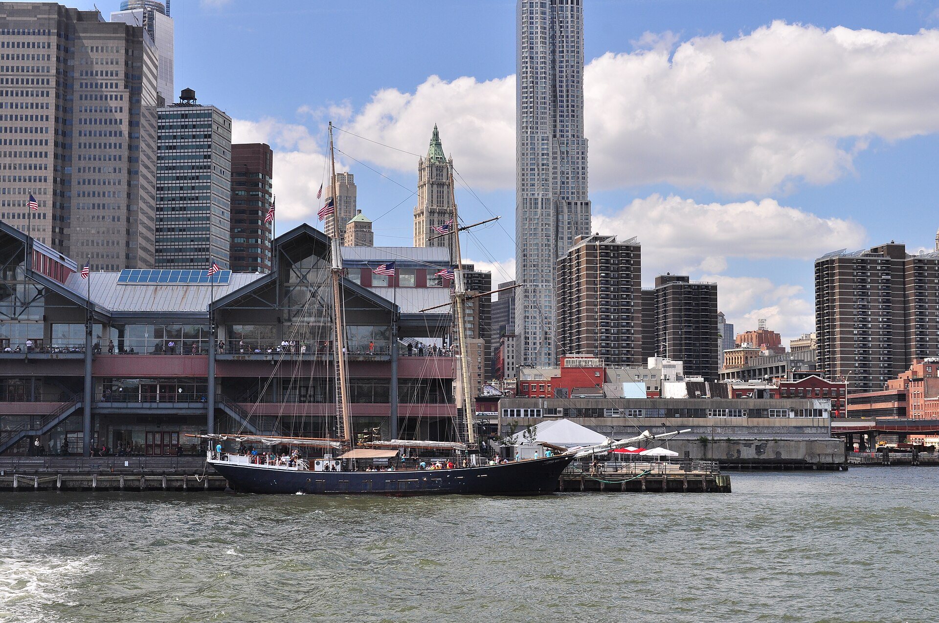 The schooner Clipper City moored at South Street Seaport with the Financial District towers behind