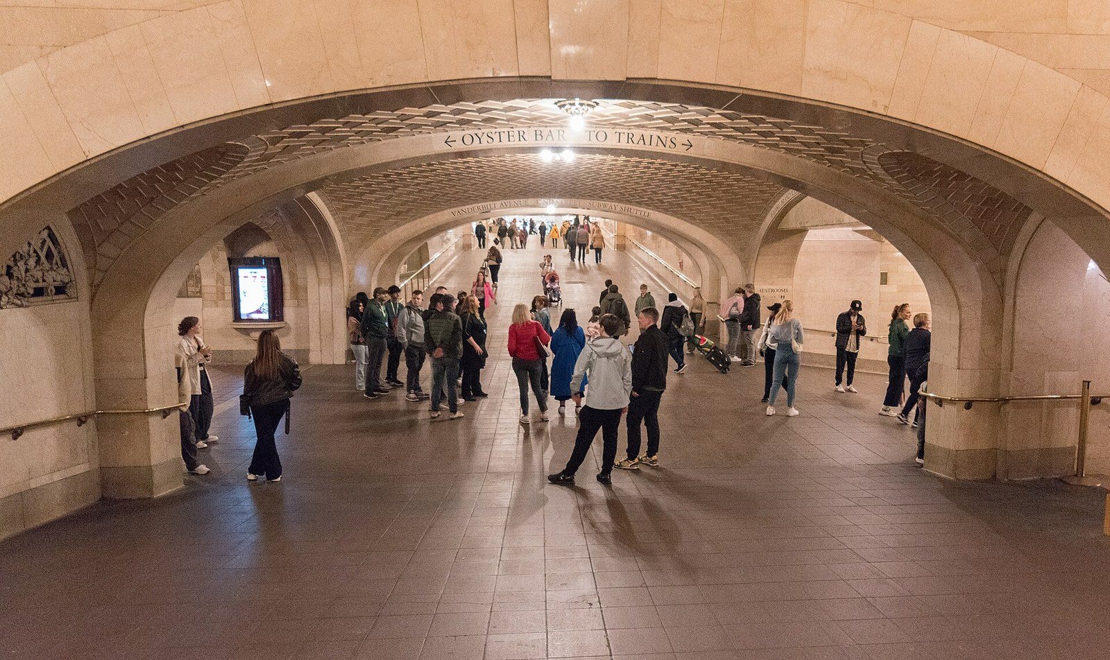 The tiled vaults of the Whispering Gallery outside the Oyster Bar in Grand Central Terminal, with travelers passing through