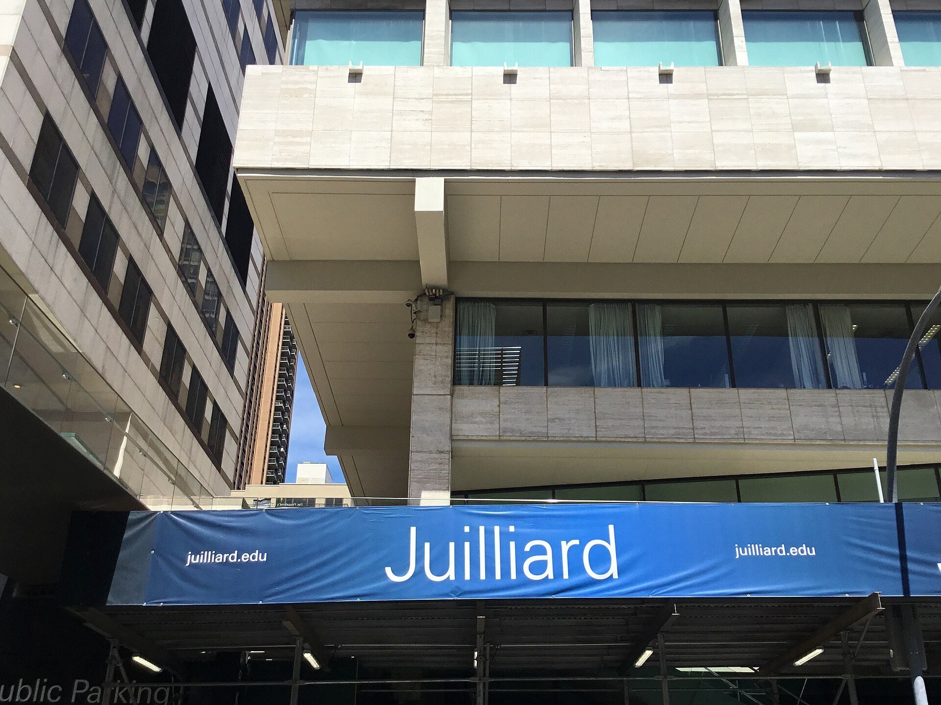 The Juilliard School building on West 65th Street with its blue Juilliard banner