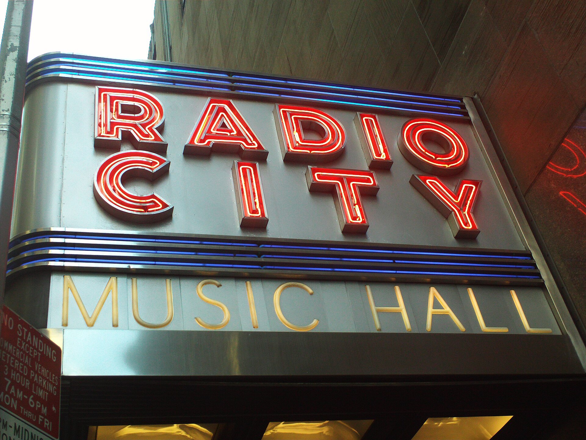 The red neon Radio City Music Hall sign over Sixth Avenue