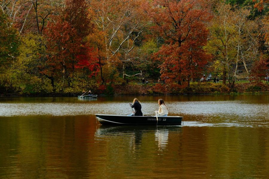 A rowboat on the Lake among autumn trees