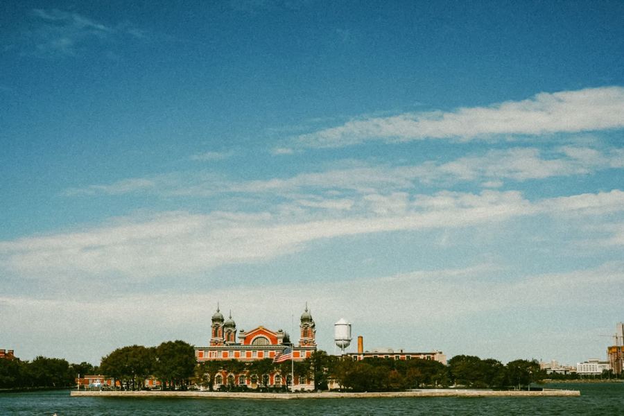 Ellis Island across the harbor under a wide sky