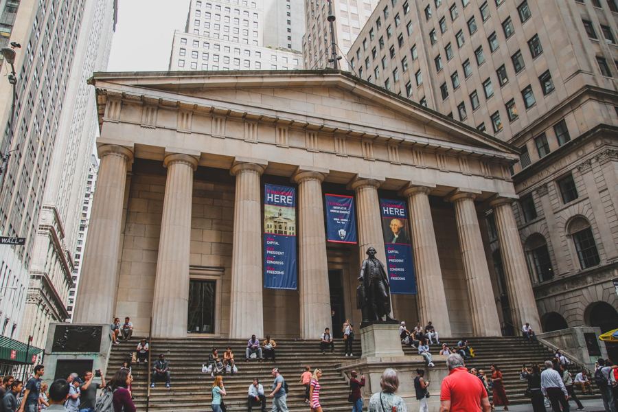 Federal Hall's Doric columns and George Washington statue on Wall Street