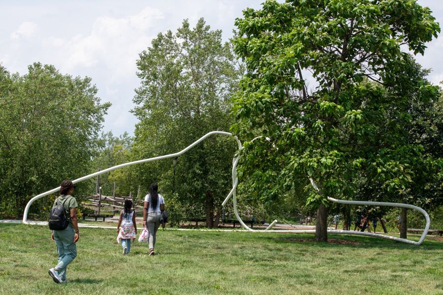 Mark Handforth's Yankee Hanger, a giant white coat-hanger sculpture among the trees, commissioned by Governors Island Arts