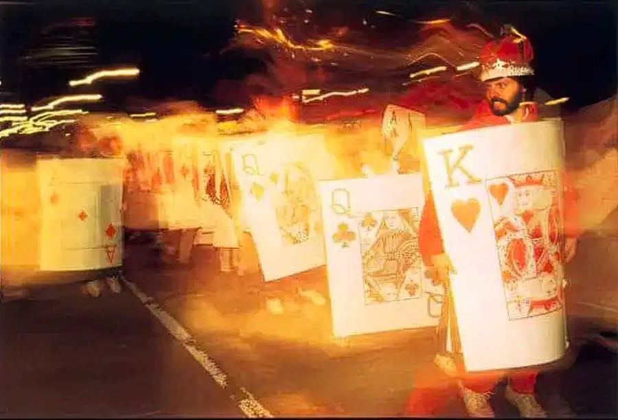 Marchers dressed as a deck of playing cards, led by the King of Hearts, in the Village Halloween Parade