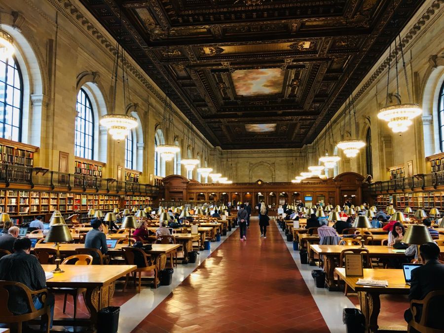 Long oak tables under the painted ceiling of the Rose Main Reading Room