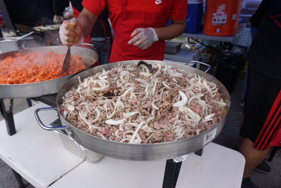 Pans of food at a market stall