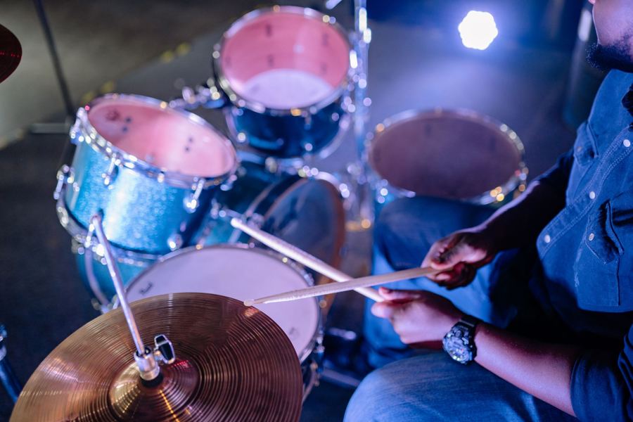 A jazz drum kit under blue light