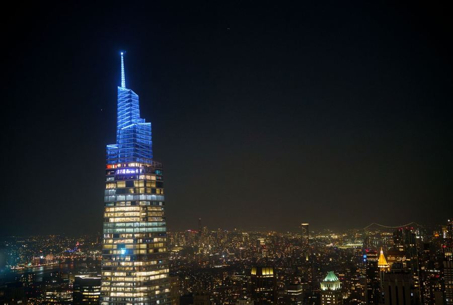 One Vanderbilt's spire lit blue at night