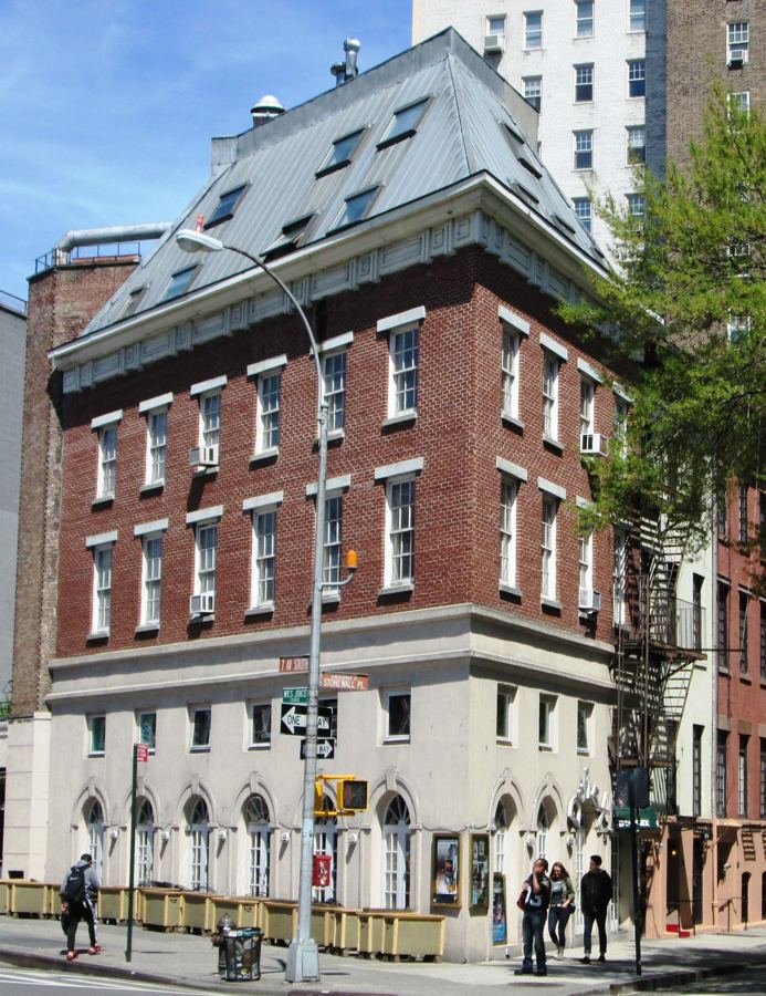 The brick corner building at 61 Christopher Street, home of The Duplex, on Sheridan Square
