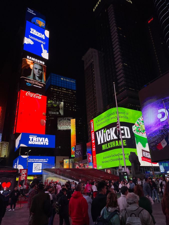 Times Square's screens at night, home of the TKTS booth