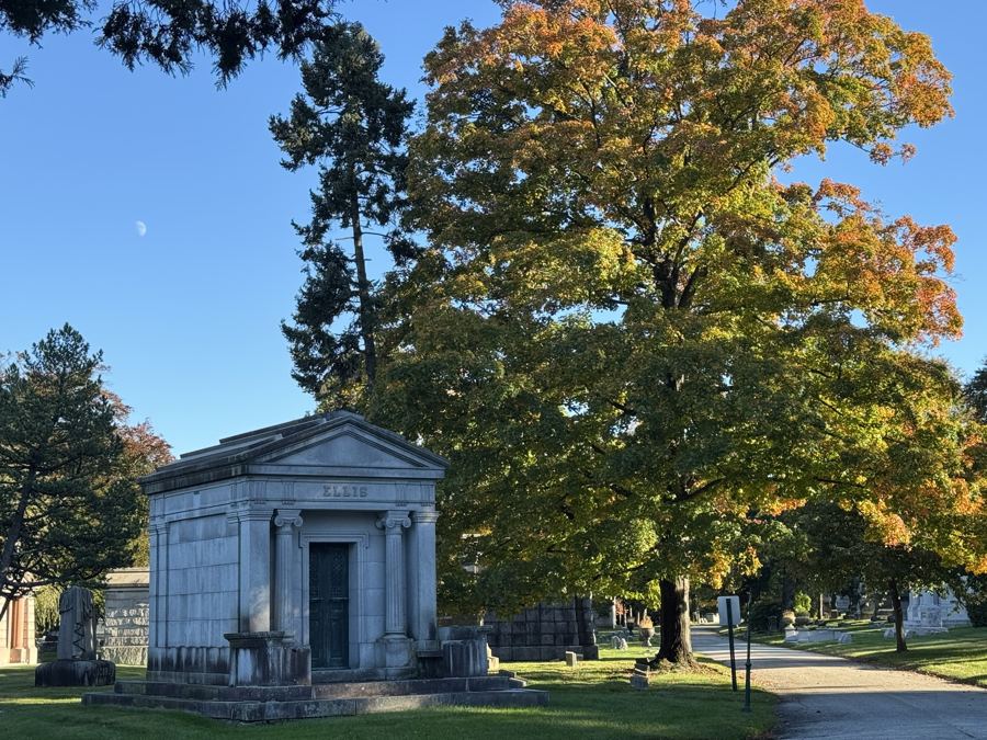 A classical mausoleum under autumn trees at Woodlawn