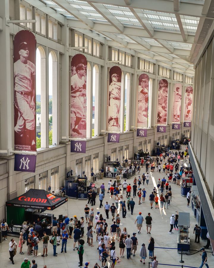 The Great Hall inside Yankee Stadium, hung with banners of Yankees legends and busy with fans