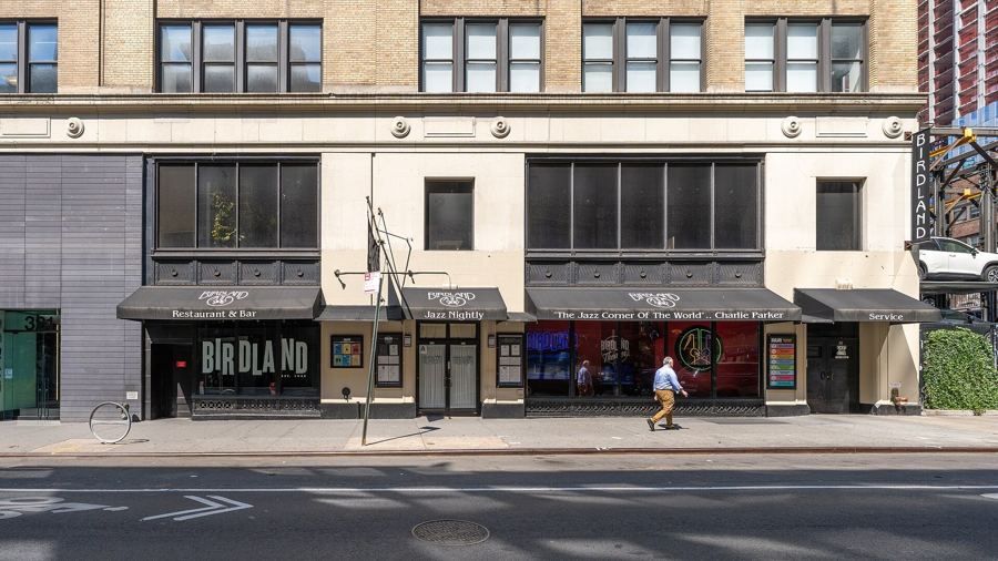 The Birdland marquee and storefronts on West 44th Street in daylight, 2026