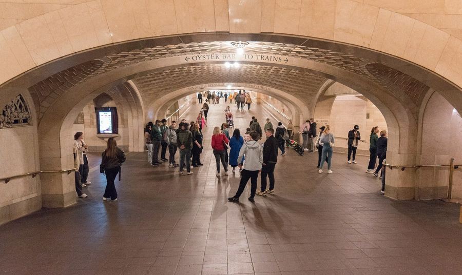 The tiled vaults of the Whispering Gallery outside the Oyster Bar in Grand Central Terminal, with travelers passing through