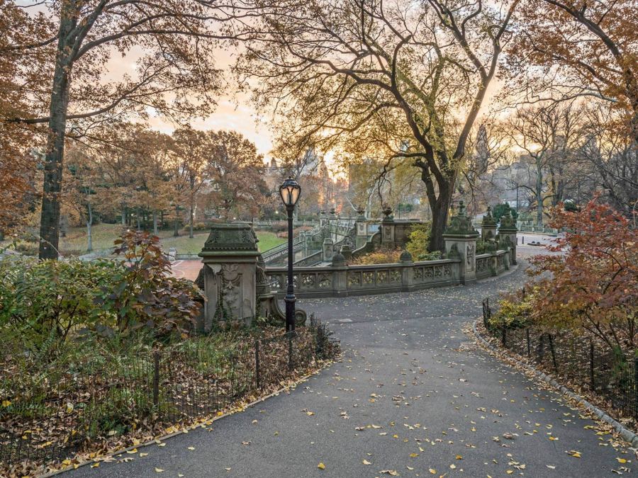 Bethesda Terrace in Central Park in late autumn, leaves down and lamps along the path