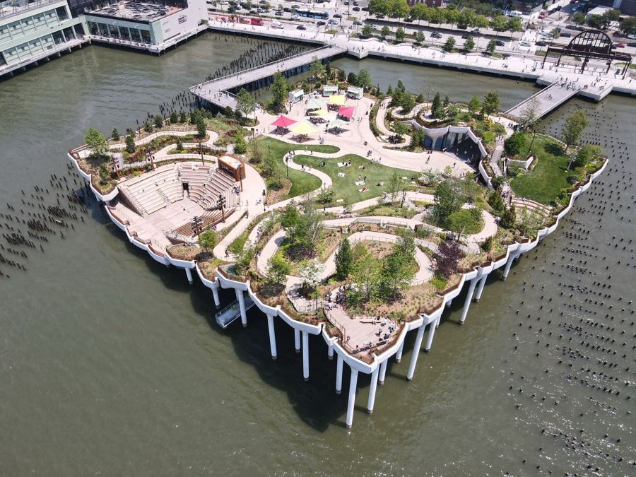Little Island's sculptural concrete planters rising from the Hudson, paths and trees on top