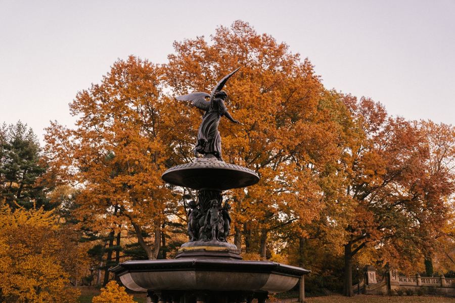 The Angel of the Waters framed by autumn trees