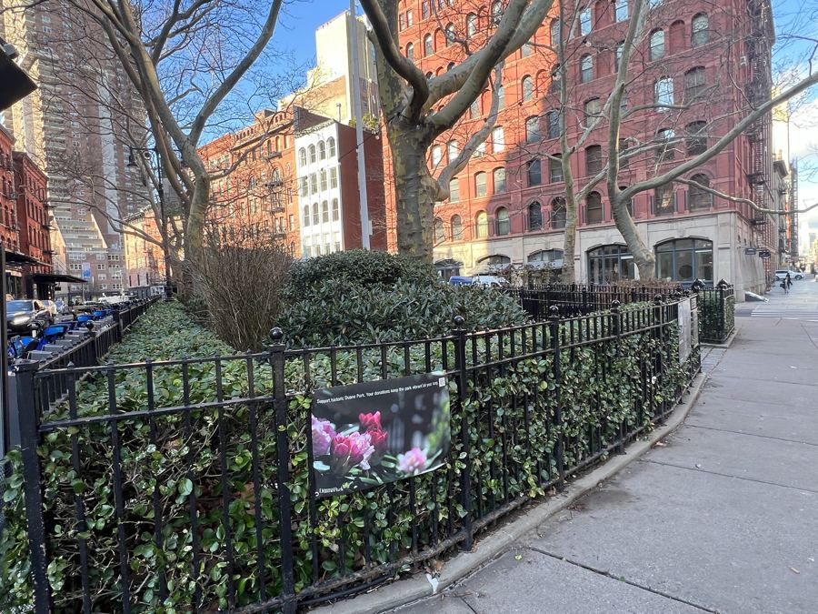 The small iron-fenced triangle of Duane Park in Tribeca