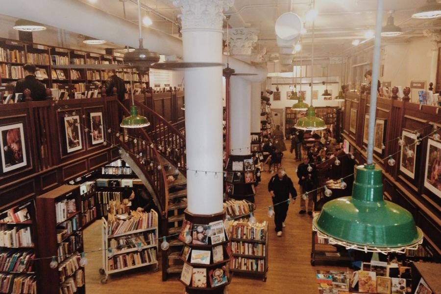 The two-level, wood-shelved interior of Housing Works Bookstore Cafe