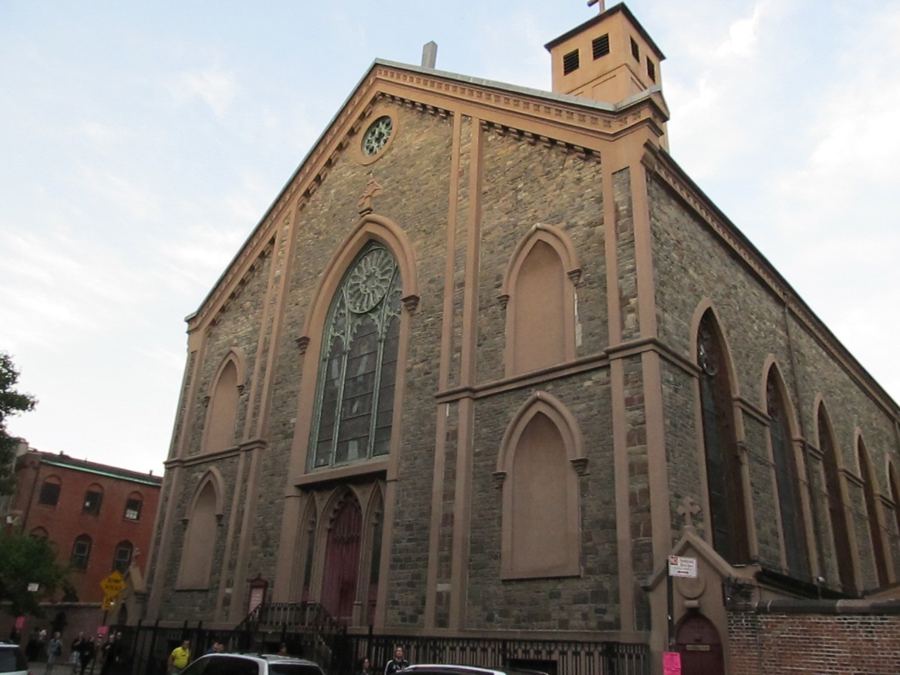 The stone Gothic Revival facade of the Basilica of St. Patrick's Old Cathedral on Mulberry Street