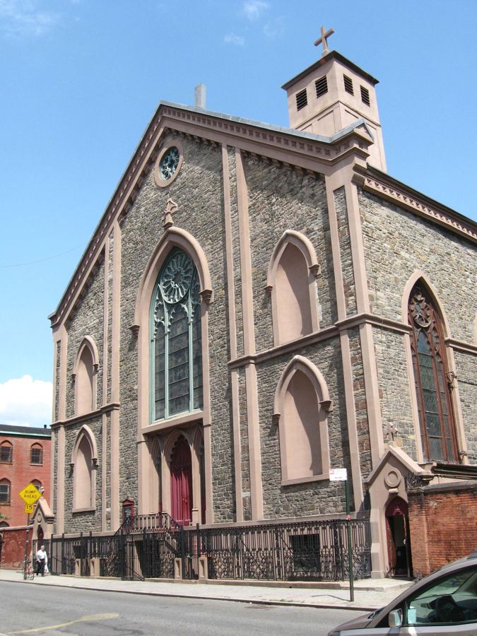 Old St. Patrick's seen down Mulberry Street, with its square bell tower and churchyard wall
