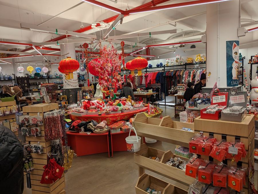 The red-lantern-decked shop floor of Pearl River Mart with displays of Chinese New Year goods