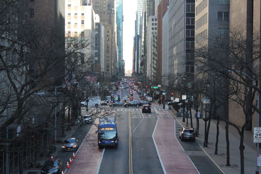 The view west down tree-lined East 42nd Street from the Tudor City Place overpass