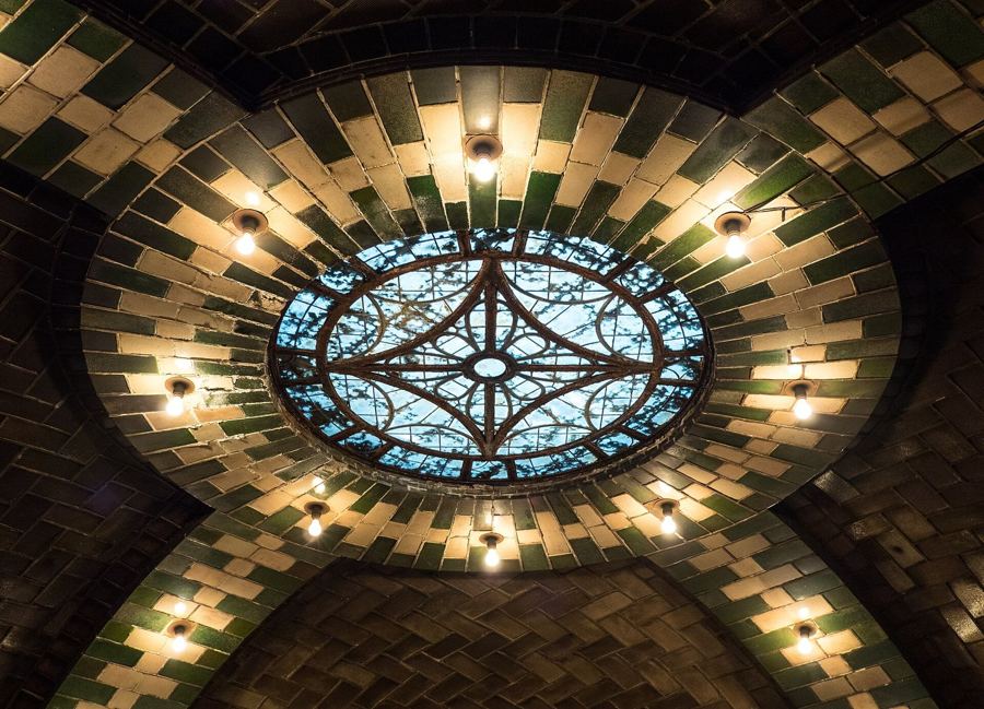 The leaded-glass skylight in the vaulted ceiling of the abandoned City Hall subway station