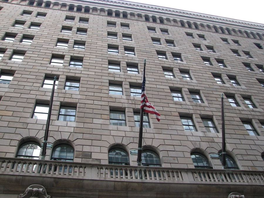 The fortress-like stone facade of the Federal Reserve Bank of New York on Liberty Street