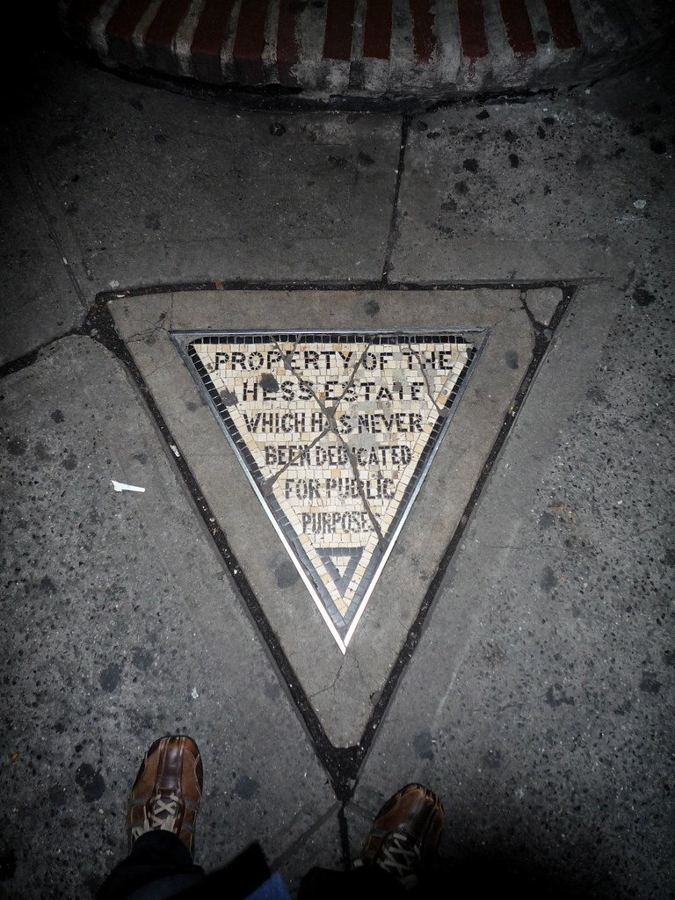 The Hess Triangle mosaic set into the sidewalk at Seventh Avenue South and Christopher Street