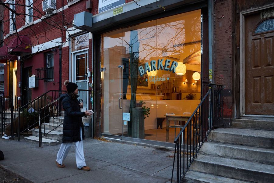 Barker Cafeteria's glowing storefront on Nostrand Avenue at dusk