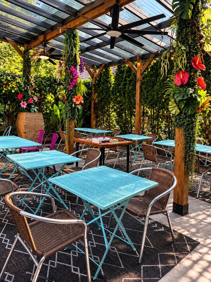 The plant-filled back patio at Borikén