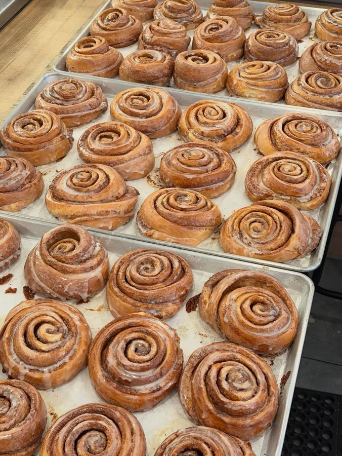 Trays of glazed cinnamon rolls fresh from the oven at Ceremonia Bakeshop