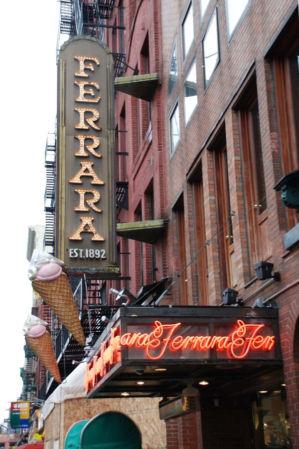Ferrara Bakery & Cafe's neon sign and storefront on Grand Street