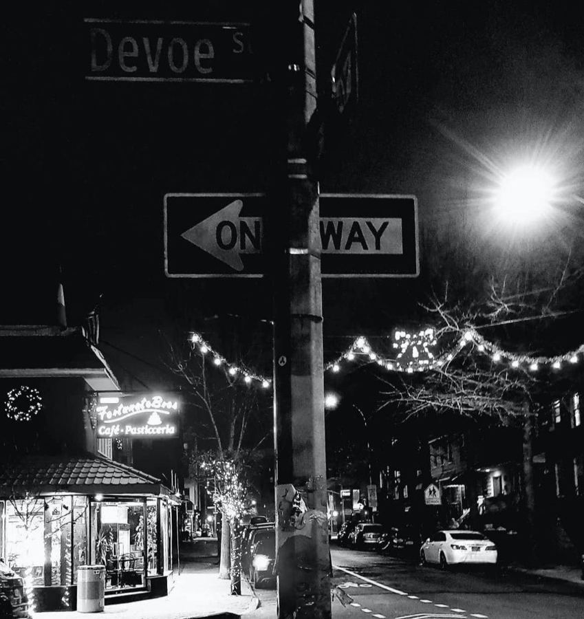 Fortunato Brothers' lit sign on Manhattan Avenue at Devoe Street at night