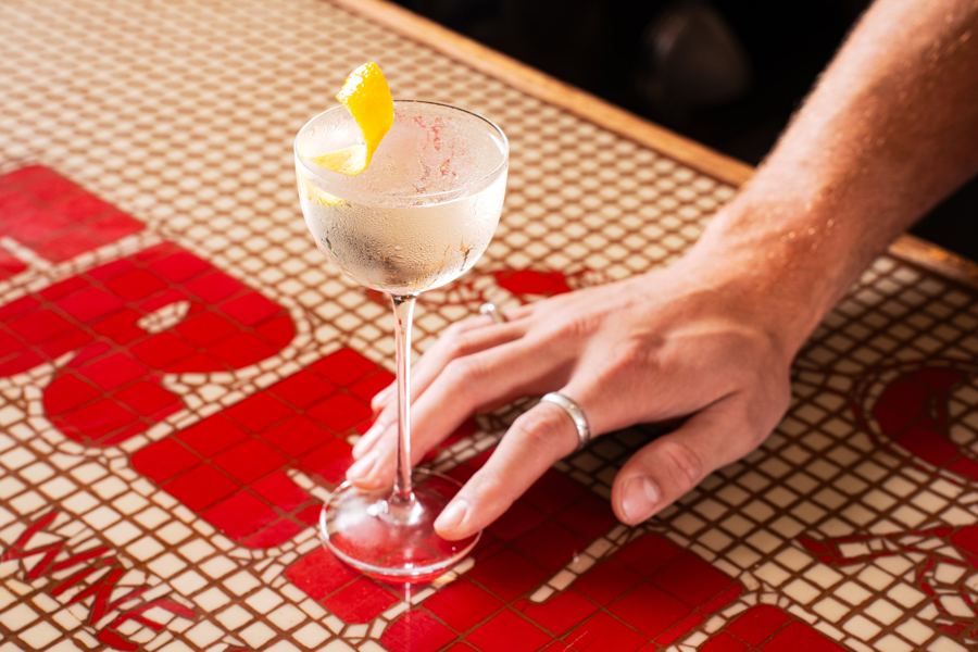 The Frenzie martini with a lemon twist on the tiled bar