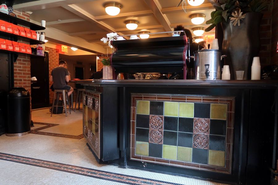 The tiled espresso counter and coffered ceiling of the Intelligentsia coffee bar inside the High Line Hotel in Chelsea