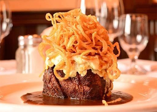 A filet mignon crowned with Gorgonzola and a tangle of fried onions at Jake's