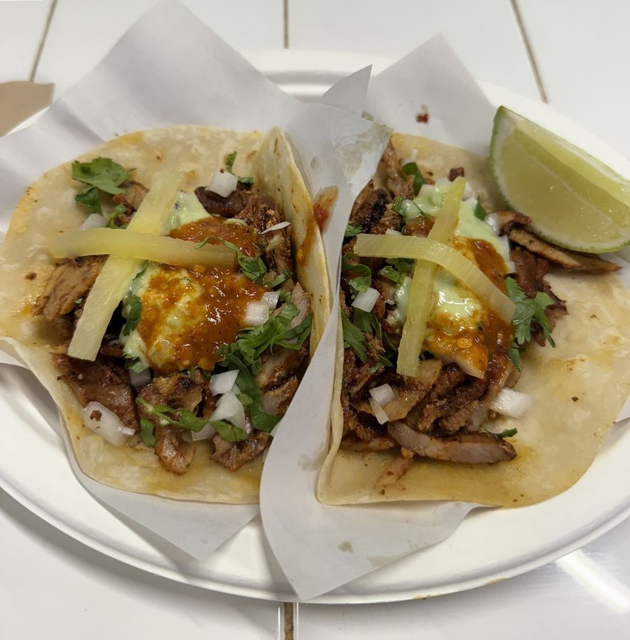 Adobada tacos with pineapple, cilantro and a lime wedge from Los Tacos No. 1
