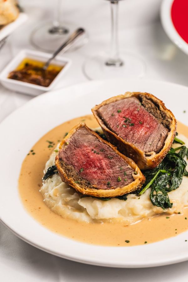 Beef Wellington over mashed potatoes at Max's Es-Ca