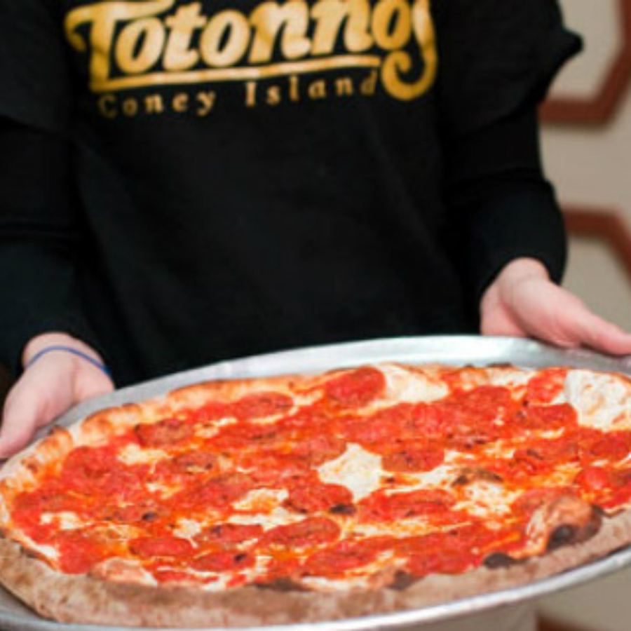 The Totonno's sign, "Family Operated Since 1924," over the shop at 1524 Neptune Avenue in Coney Island