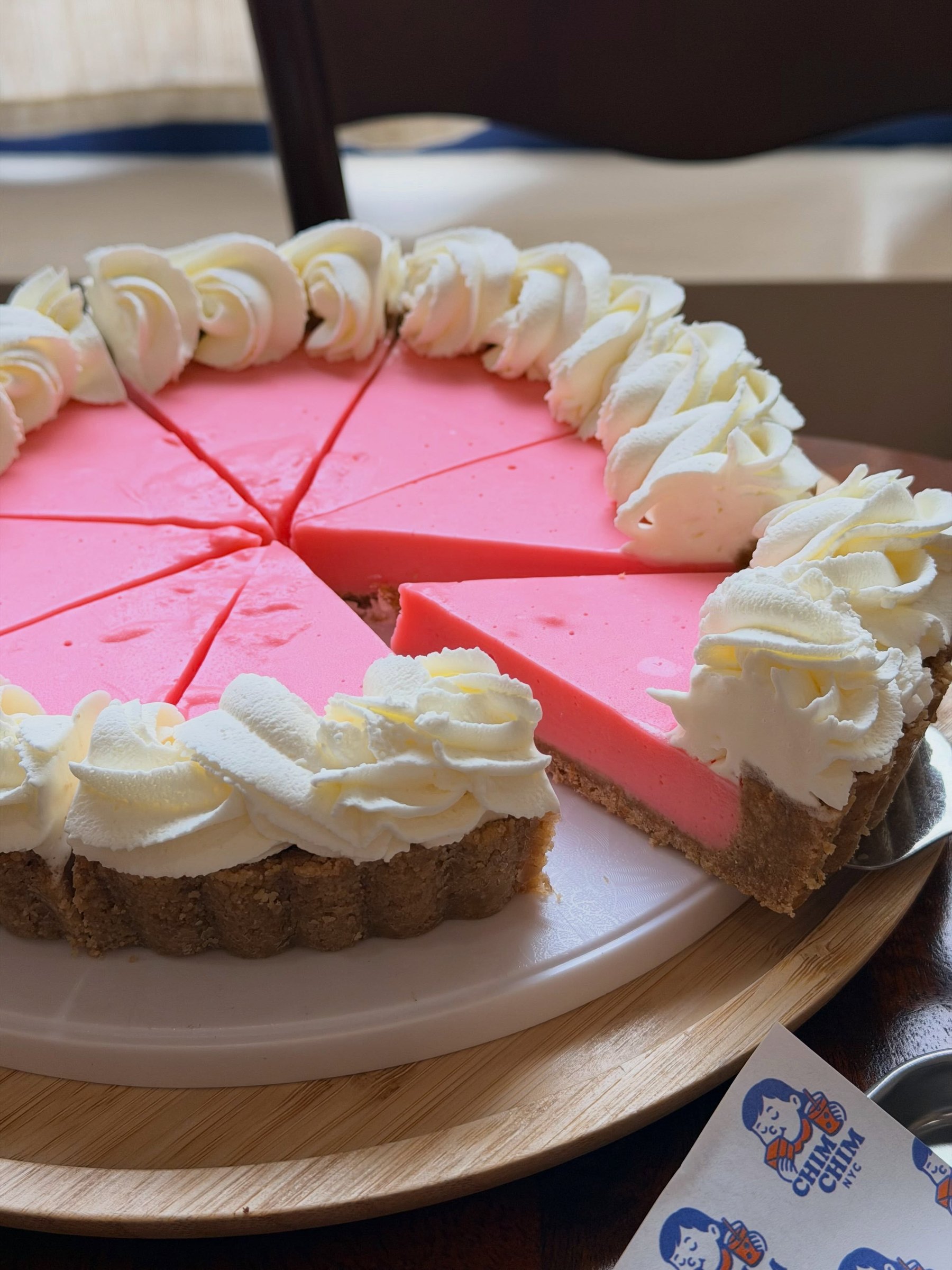 Chim Chim's pink milk cream pie, inspired by Thai nom yen, ringed with whipped cream rosettes