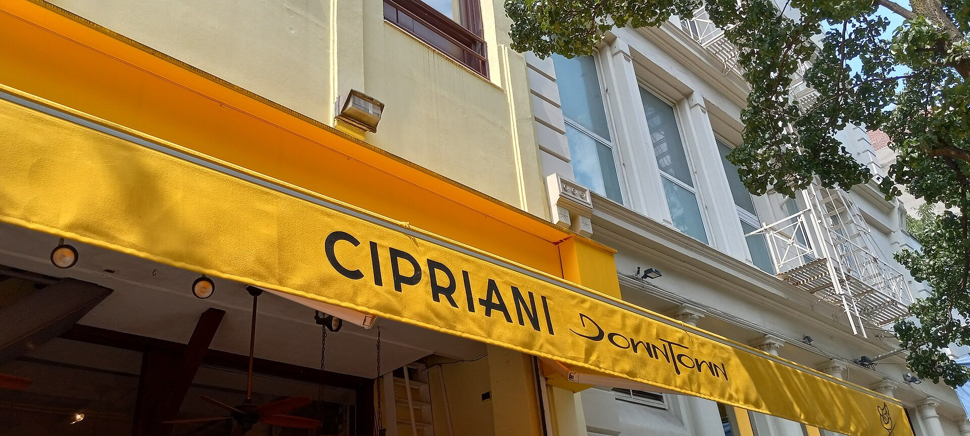 Cipriani Downtown's yellow awning on West Broadway in SoHo